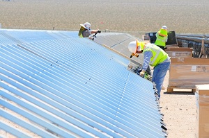 Workers installing PV mounting in Nevada