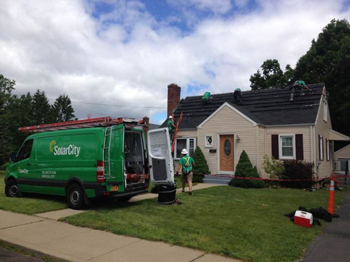 SolarCity installing solar on a Conn. home. Courtesy SolarCity's Facebook page.